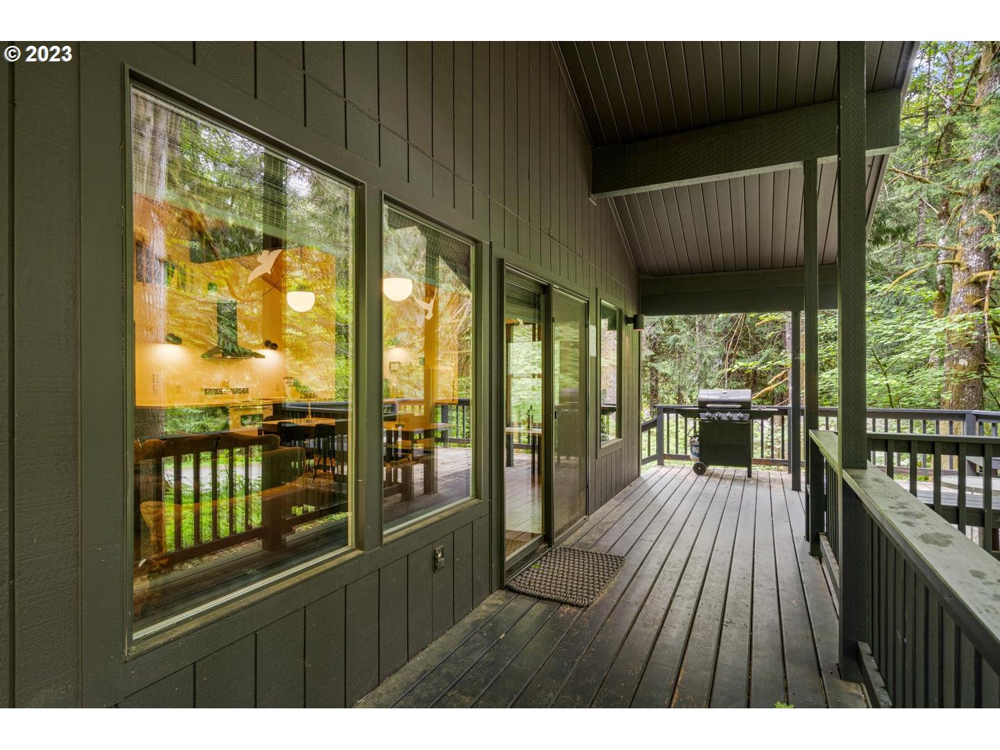 72715 East Village Loop Road Rhododendron, OR 97049 - Photo 28 of 48 a view of a porch with wooden floor and outdoor space