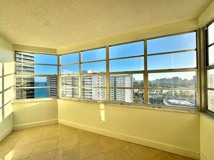 a view of an empty room with a window