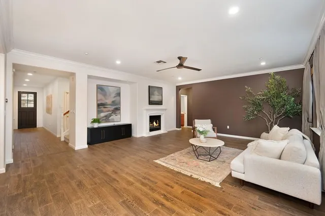 an empty room with a ceiling fan and a window