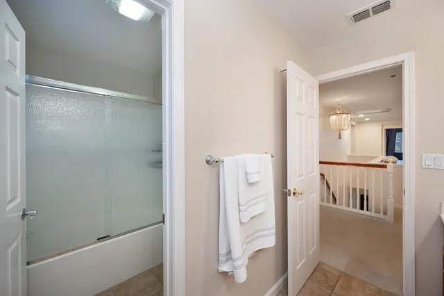 an aerial view of a house with balcony and garden