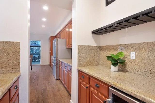 a large kitchen with a table and chairs