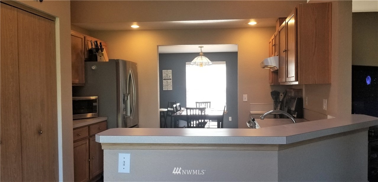 18040 Cider Court Southwest Rochester, WA 98579 - Photo 14 of 28 a view of living room with granite countertop furniture and fireplace
