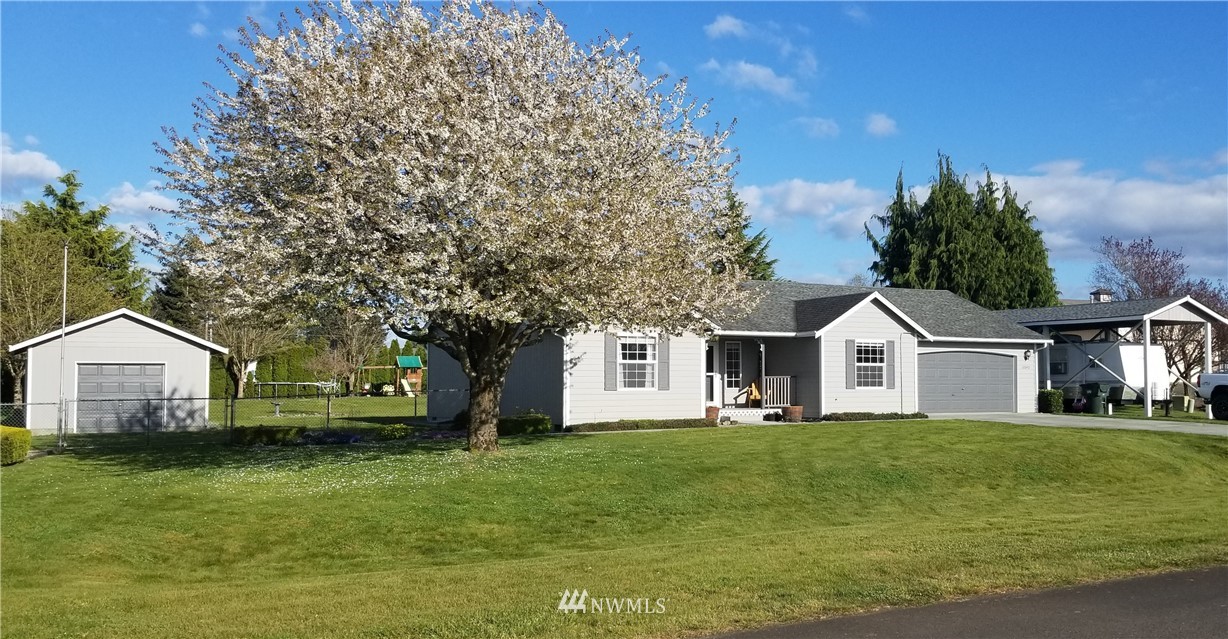 18040 Cider Court Southwest Rochester, WA 98579 - Photo 3 of 28 a front view of a house with a garden