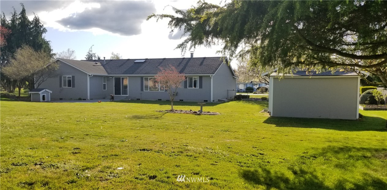 18040 Cider Court Southwest Rochester, WA 98579 - Photo 8 of 28 a view of a house with a yard