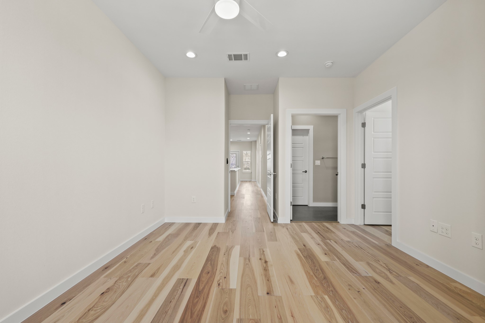 4801 Sara Drive, Unit B Austin, TX 78721 - Photo 10 of 40 a view of a big room with wooden floor and windows
