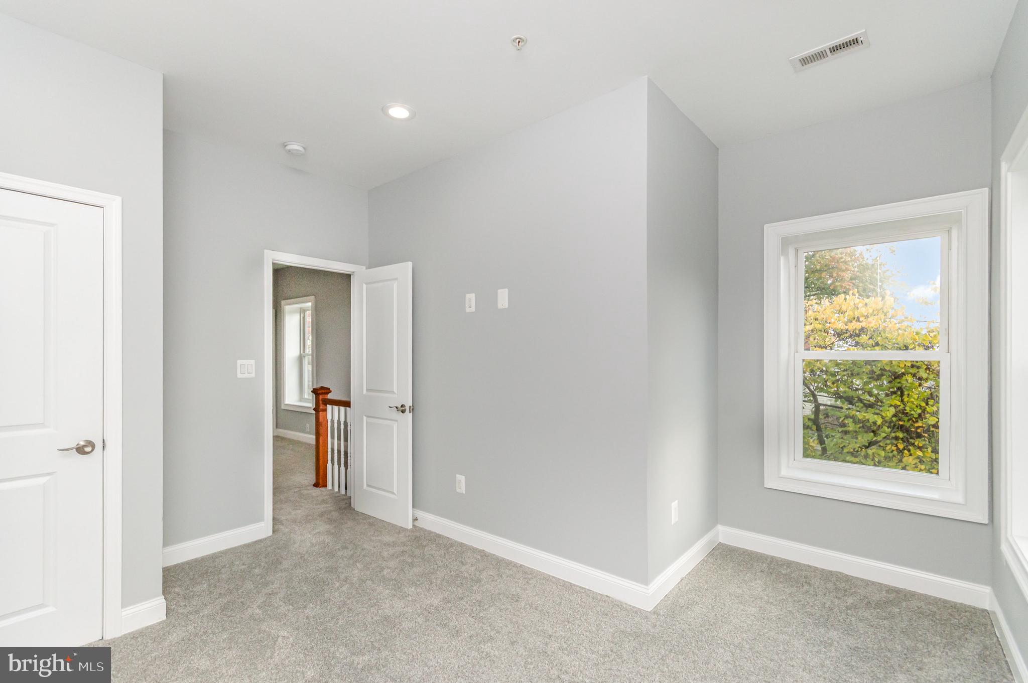 3110 Perry Street Mount Rainier, MD 20712 - Photo 14 of 24 an empty room with windows and closet