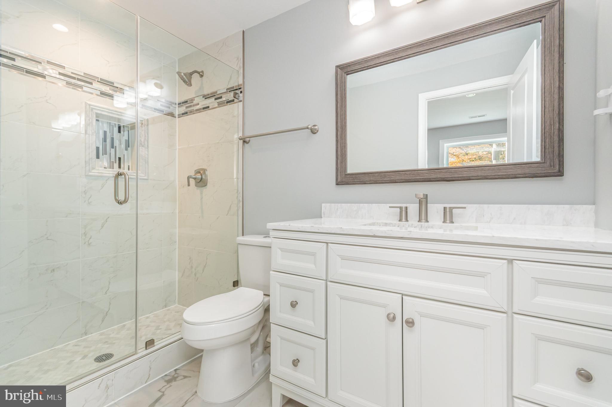 3110 Perry Street Mount Rainier, MD 20712 - Photo 6 of 24 a bathroom with a sink a toilet and shower