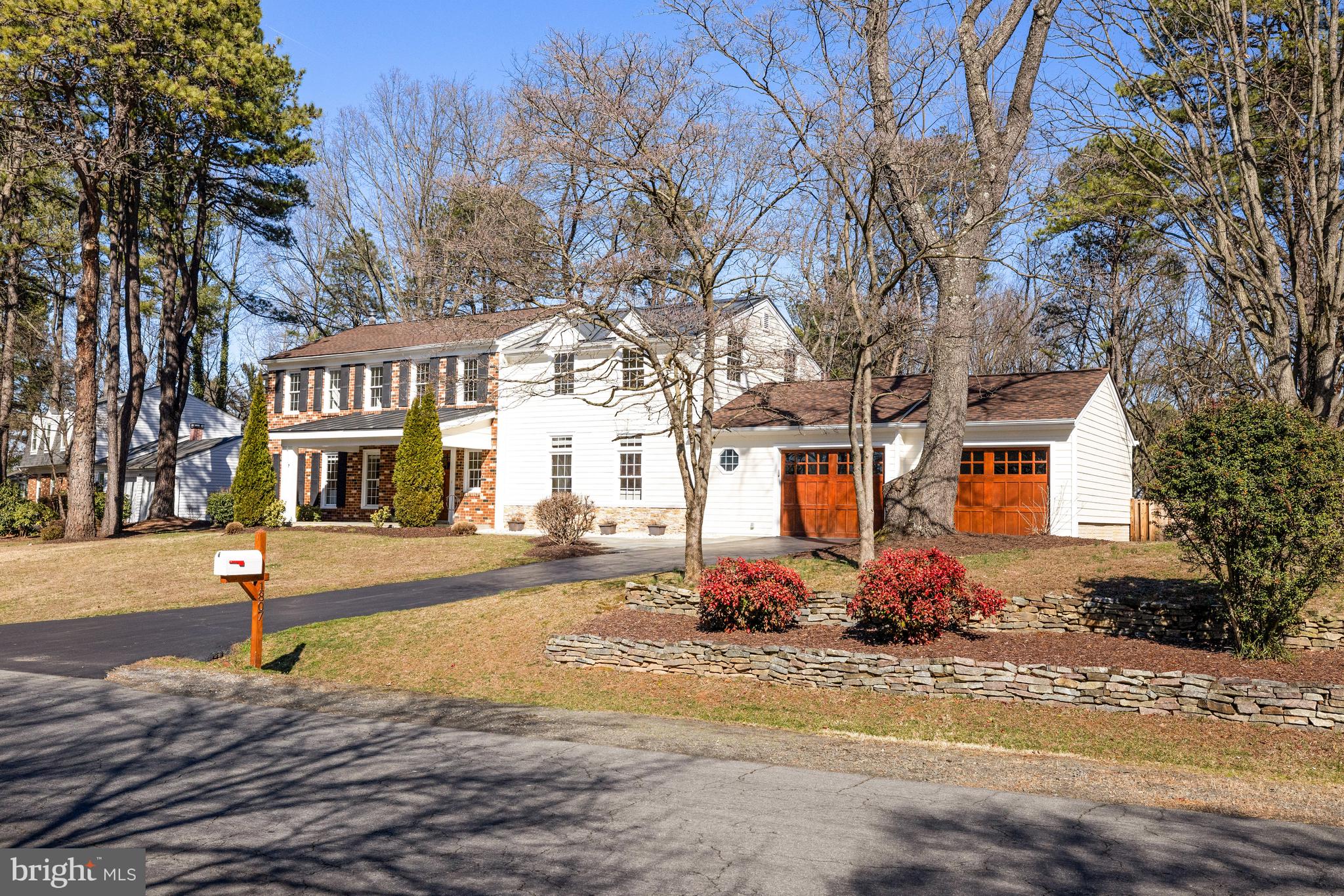 1807 Post Oak Trail Reston, VA 20191 - Photo 2 of 79 a front view of a house with a yard