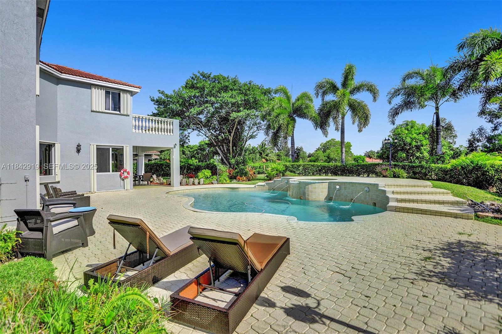 721 Ranch Road Weston, FL 33326 - Photo 13 of 38 a view of a house with pool and a yard