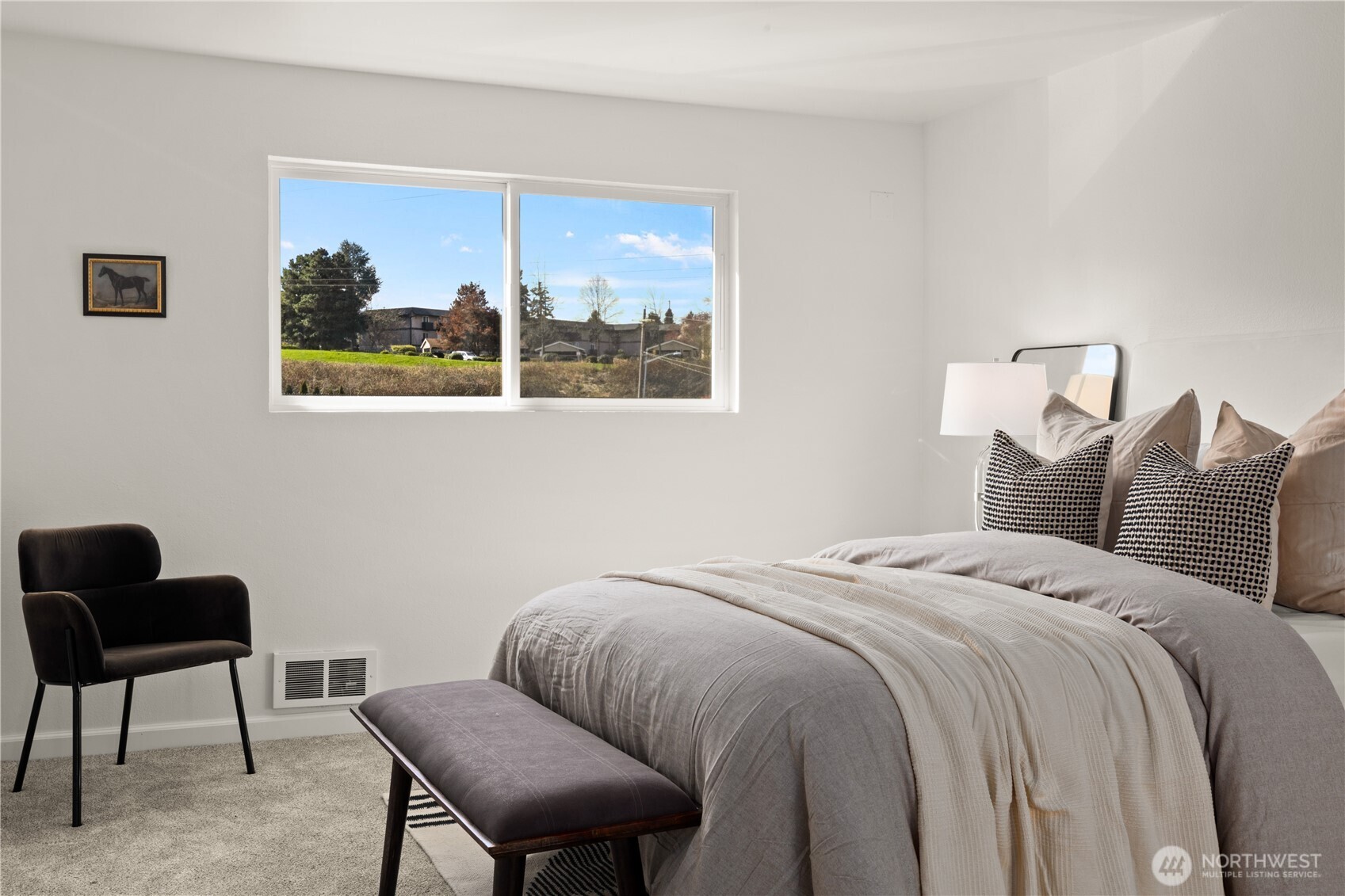 2020 Grant Avenue South, Unit A303 Renton, WA 98055 - Photo 11 of 17 a bedroom with a bed two chair and a window