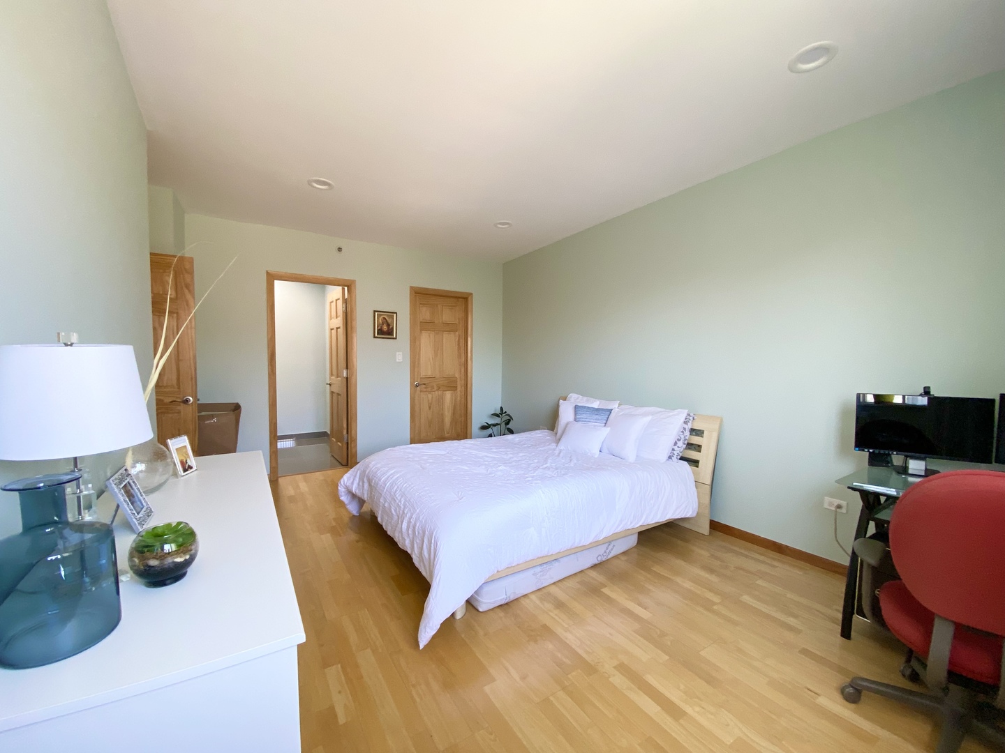 280 North Westgate Road, Unit 427 Mount Prospect, IL 60056 - Photo 14 of 23 a bedroom with a bed and wooden floor