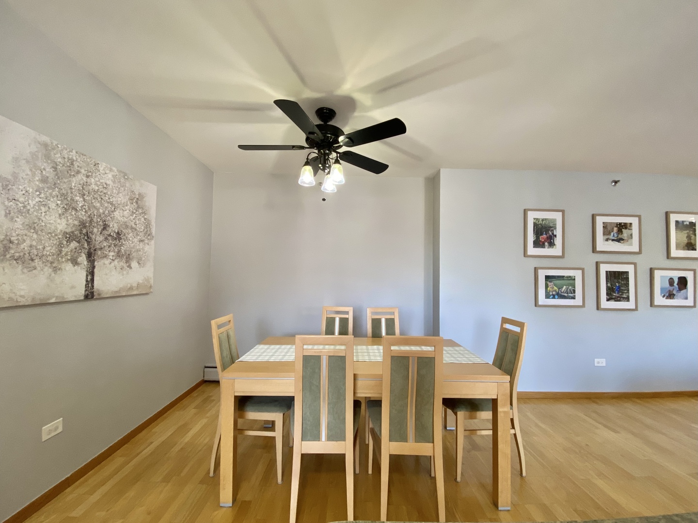 280 North Westgate Road, Unit 427 Mount Prospect, IL 60056 - Photo 9 of 23 a view of a dining room with furniture and a table with wooden floor