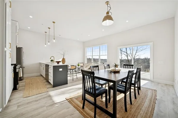 a view of a dining room with furniture window and wooden floor