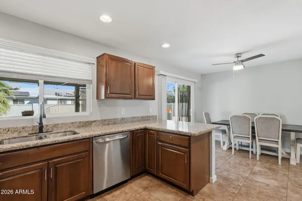 a kitchen with a sink cabinets and window