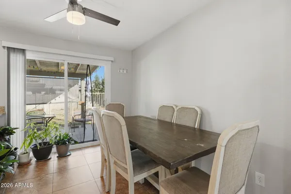 a view of a dining room with furniture window and outside view