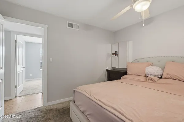 a bedroom with a bed and a shower