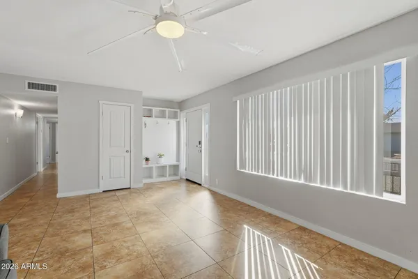 a view of an empty room with a window
