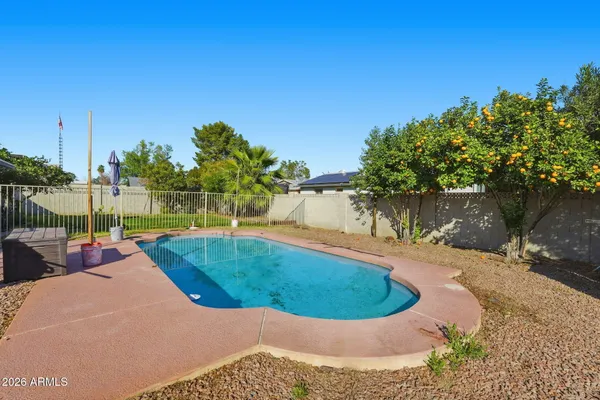 a view of a swimming pool with a patio