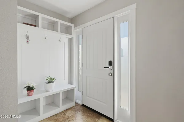 a view of an entryway with wooden floor