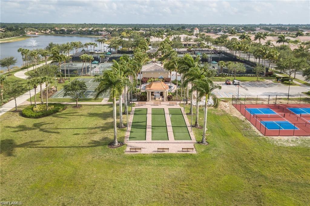 8482 Karina Court Naples, FL 34114 - Photo 32 of 40 a view of swimming pool with a garden