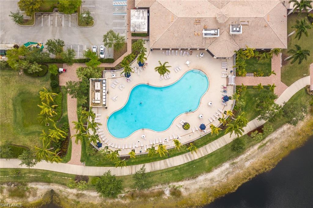 8482 Karina Court Naples, FL 34114 - Photo 35 of 40 an aerial view of a house with a swimming pool