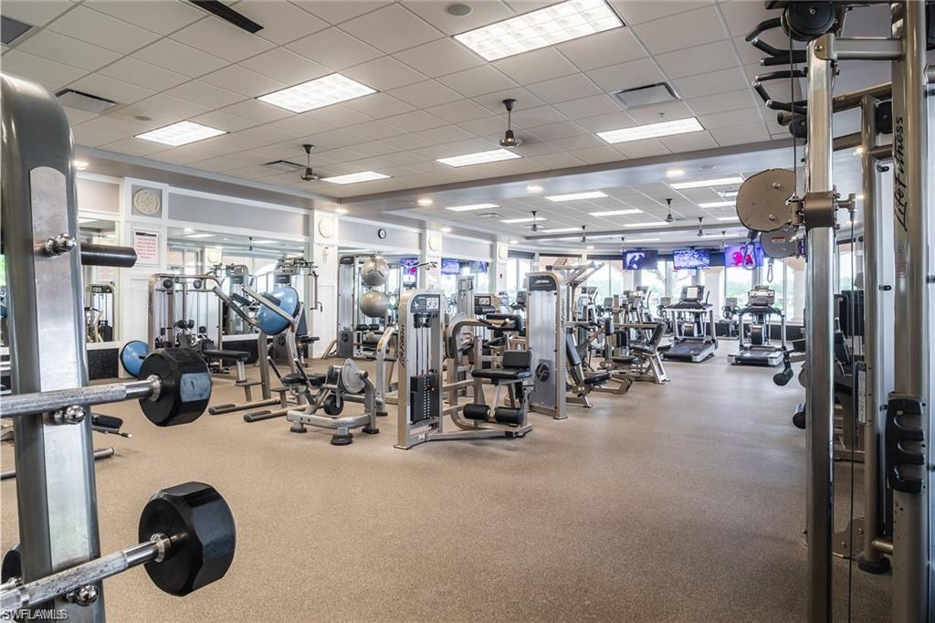 8482 Karina Court Naples, FL 34114 - Photo 37 of 40 a view of a room with gym equipment
