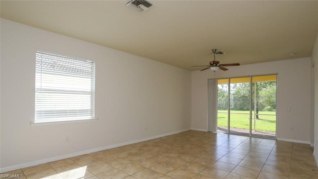 8482 Karina Court Naples, FL 34114 - Photo 6 of 40 a view of an empty room with a window
