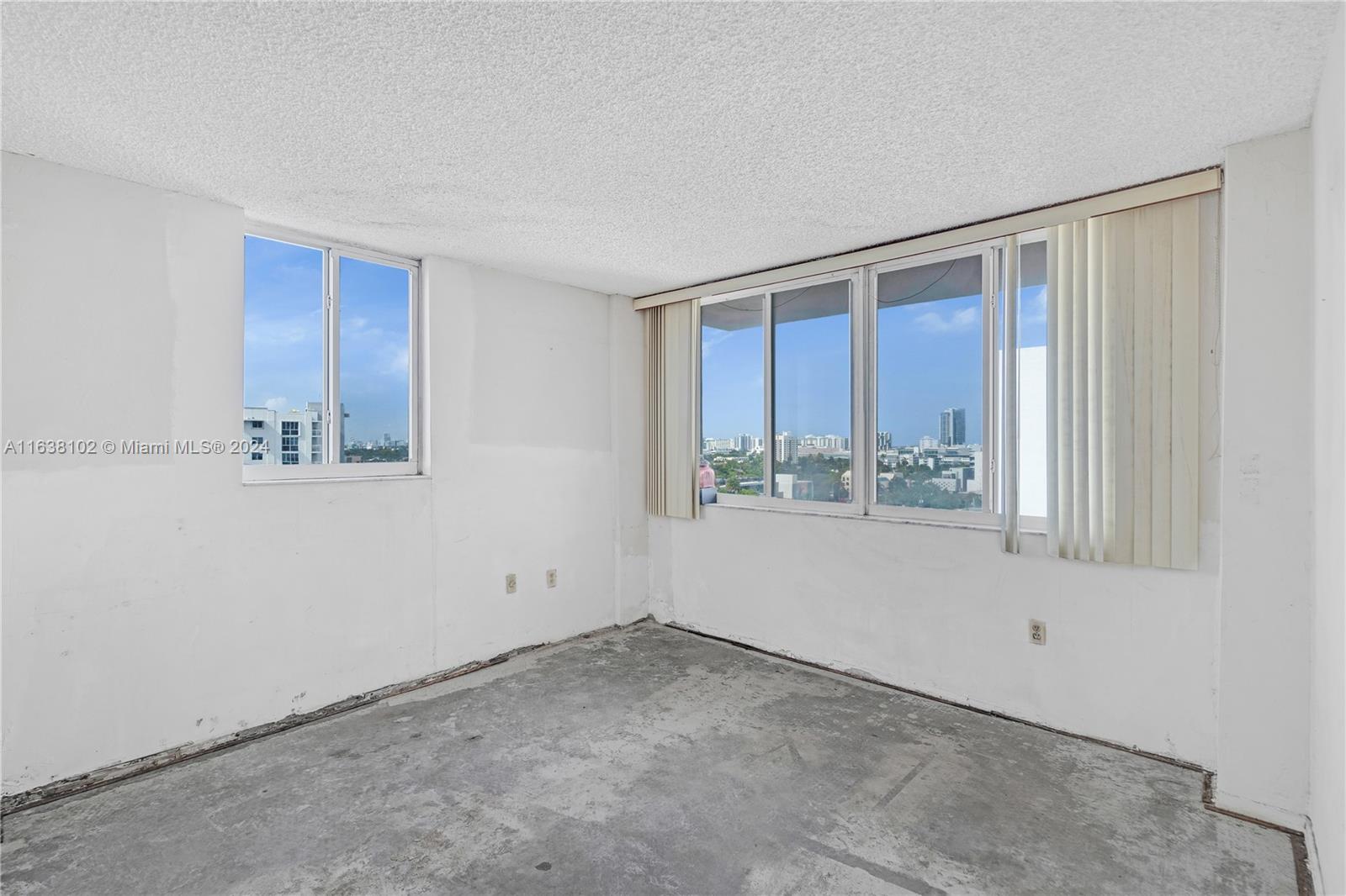 1345 Lincoln Road, Unit PH6 Miami Beach, FL 33139 - Photo 12 of 35 a view of an empty room with a window