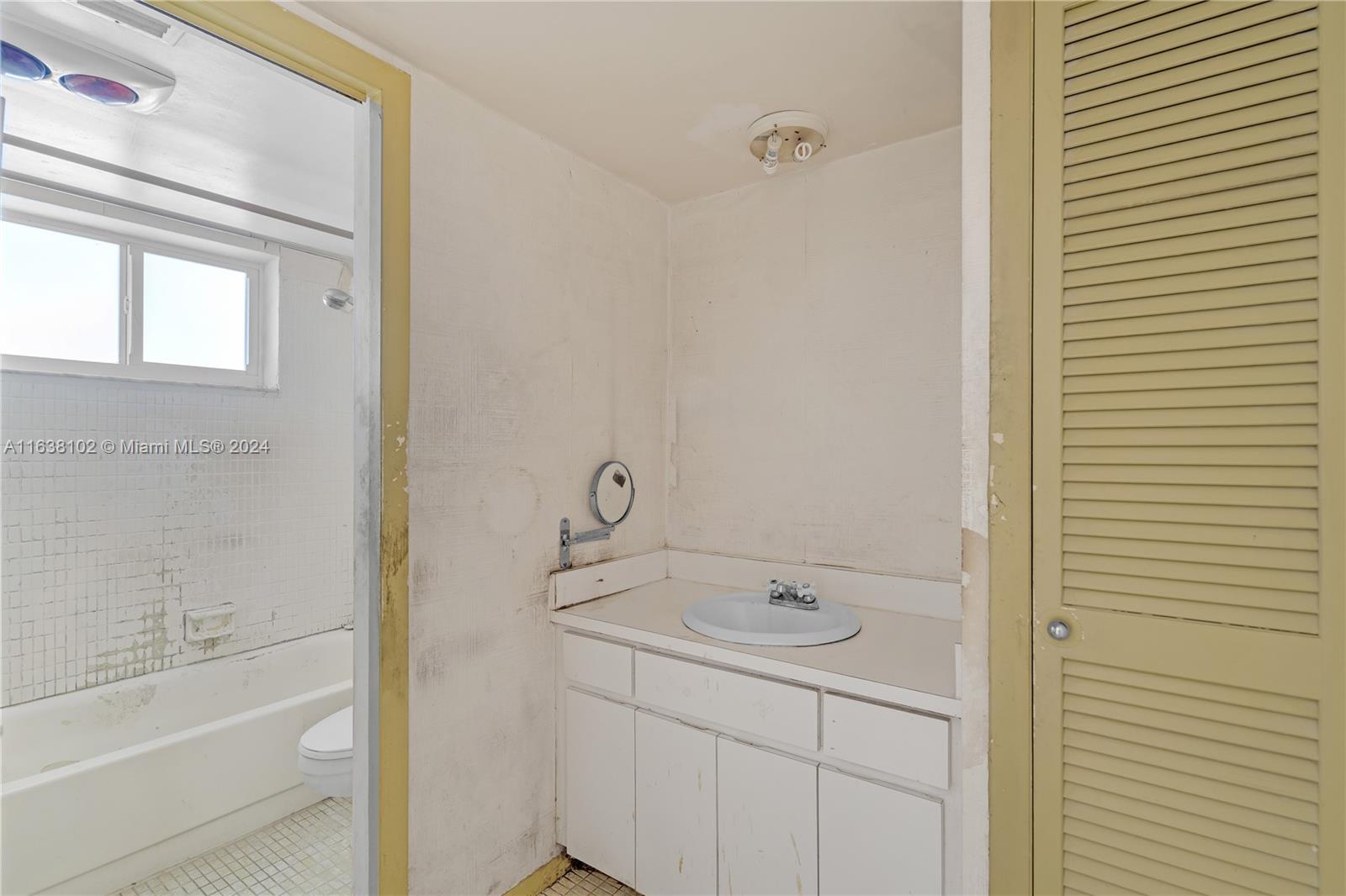1345 Lincoln Road, Unit PH6 Miami Beach, FL 33139 - Photo 14 of 35 a bathroom with a sink a toilet and shower