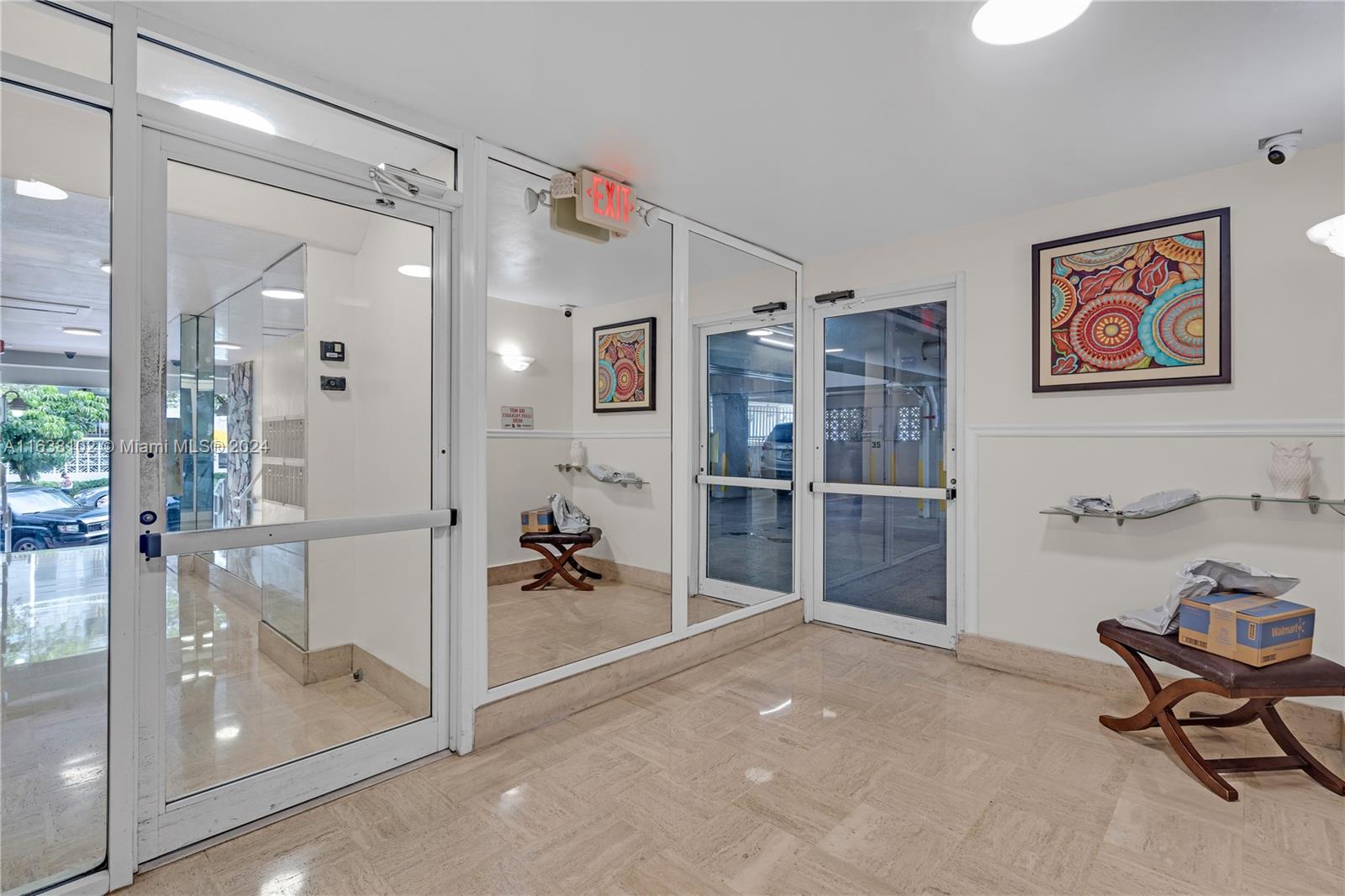 1345 Lincoln Road, Unit PH6 Miami Beach, FL 33139 - Photo 3 of 35 a view of a hallway with dining area and glass door