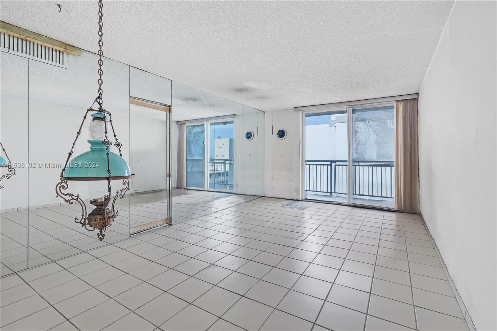 1345 Lincoln Road, Unit PH6 Miami Beach, FL 33139 - Photo 5 of 35 a view of empty room with wooden floor and fan