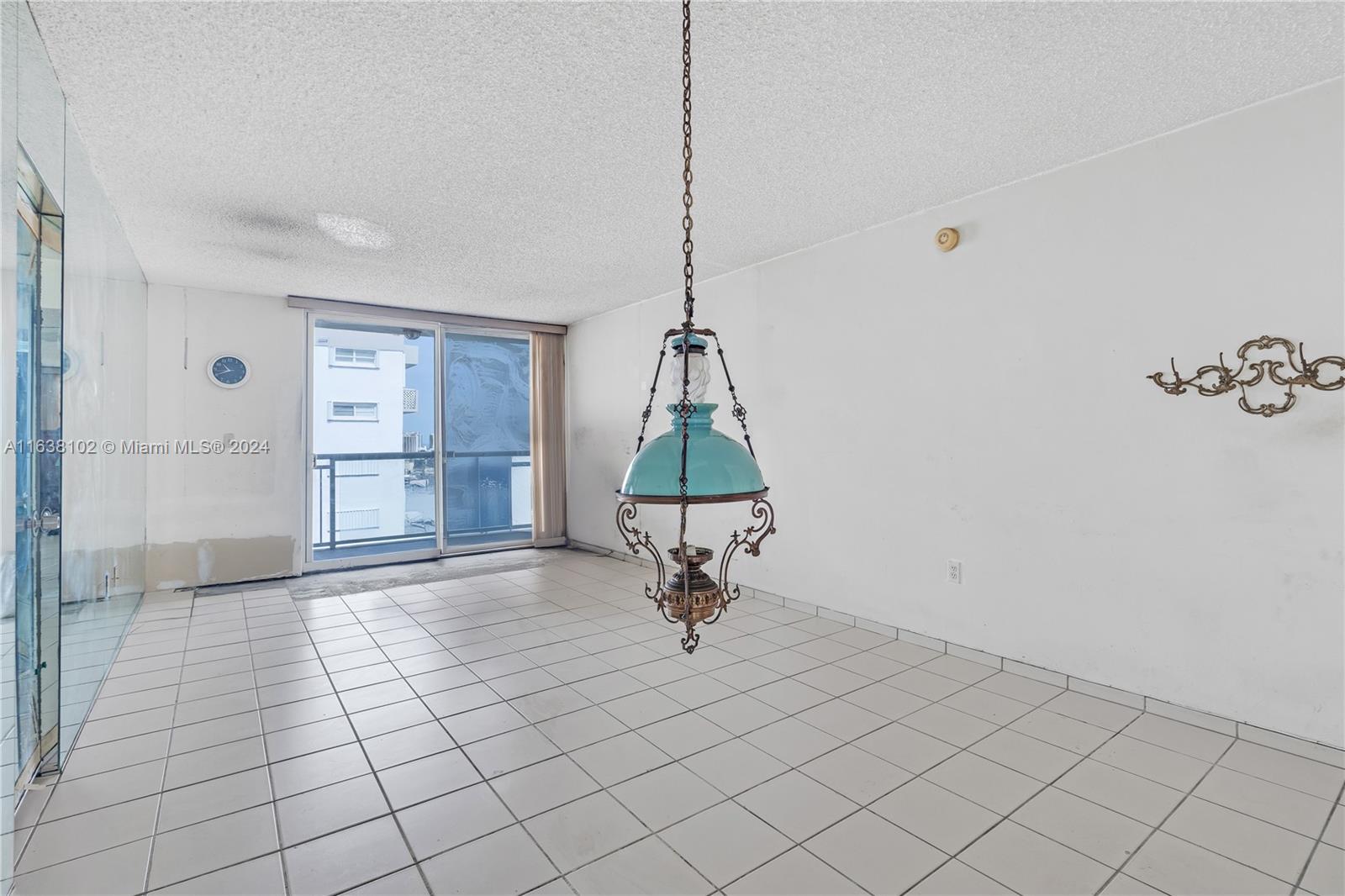 1345 Lincoln Road, Unit PH6 Miami Beach, FL 33139 - Photo 6 of 35 a room with a walk in closet and wooden floor