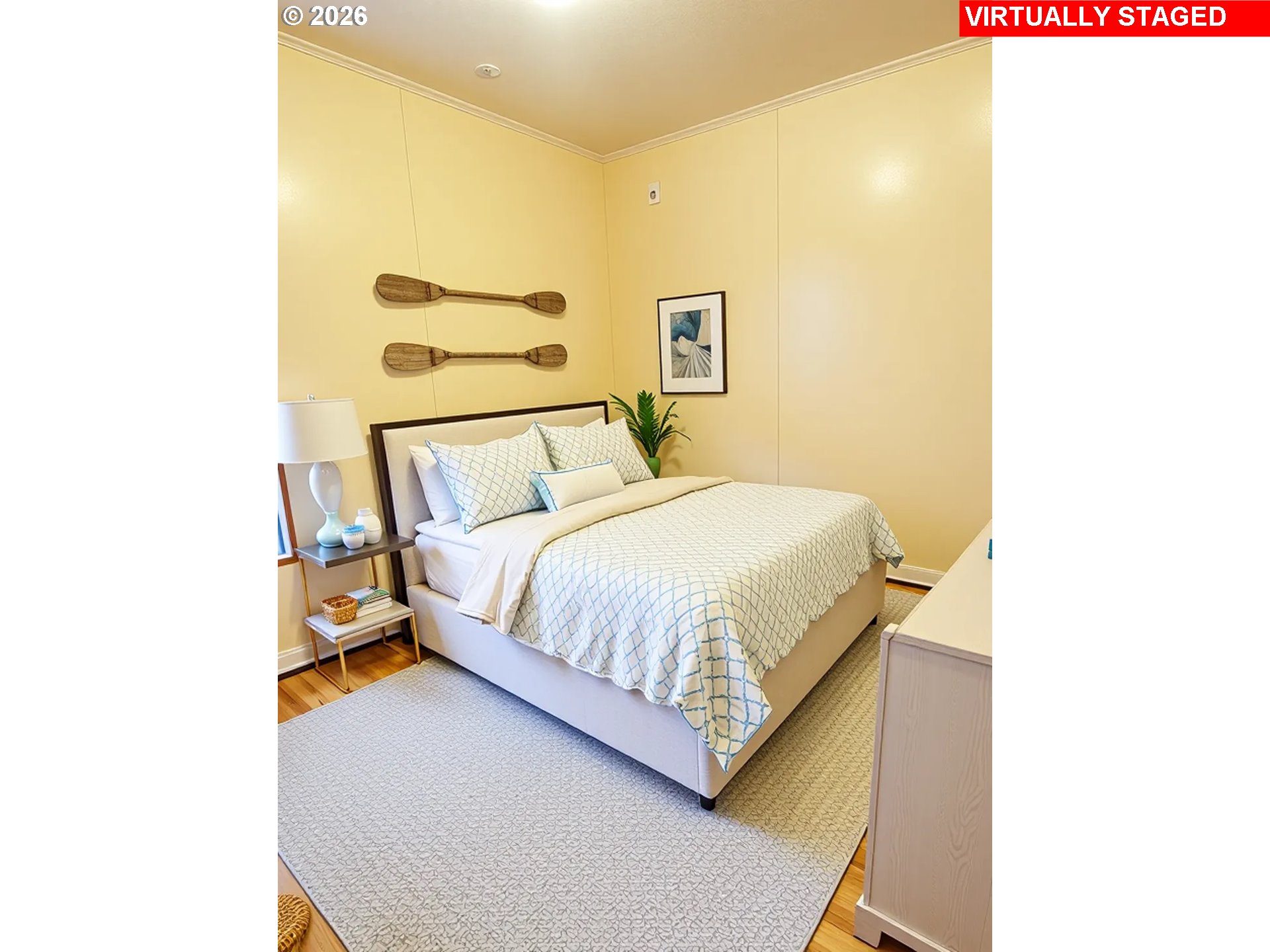 33130 Nesika Road, Unit A Gold Beach, OR 97444 - Photo 15 of 17 a bedroom with a bed and a wall painting