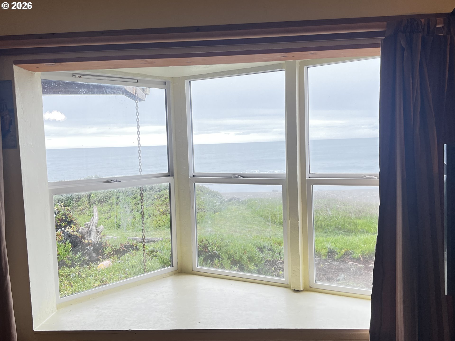 33130 Nesika Road, Unit A Gold Beach, OR 97444 - Photo 17 of 17 a view of a room that has a large window