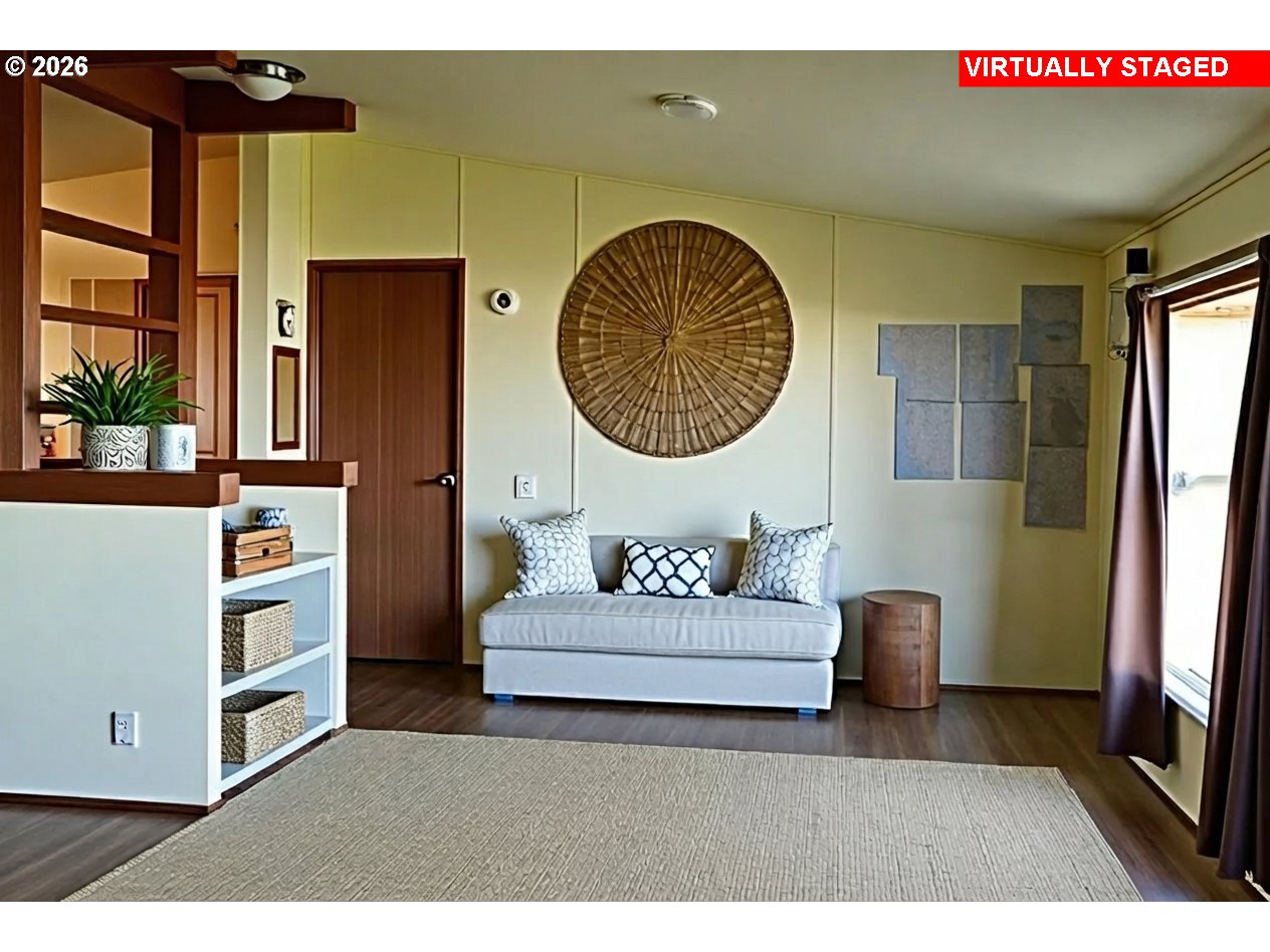 33130 Nesika Road, Unit A Gold Beach, OR 97444 - Photo 6 of 17 a living room with furniture and a flat screen tv