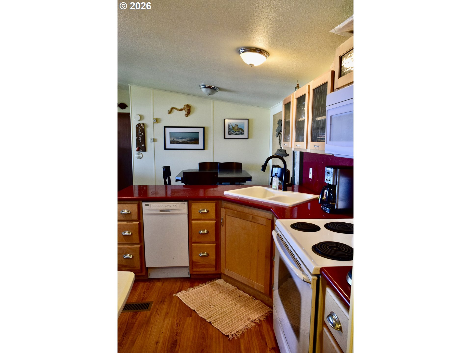 33130 Nesika Road, Unit A Gold Beach, OR 97444 - Photo 8 of 17 a kitchen with a sink and a stove top oven