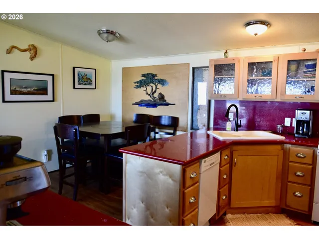 a dining room with a table and chairs