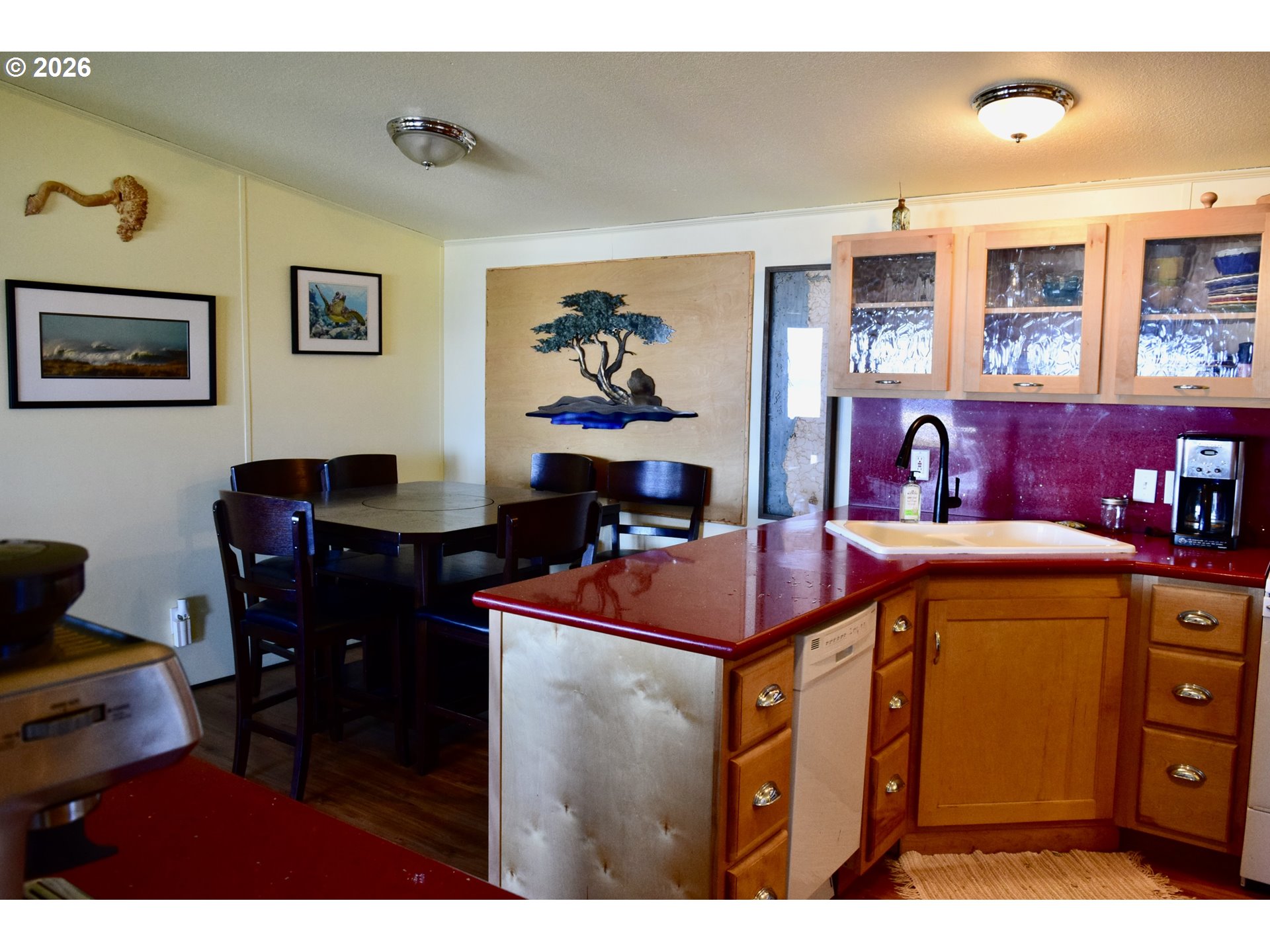 33130 Nesika Road, Unit A Gold Beach, OR 97444 - Photo 9 of 17 a dining room with a table and chairs