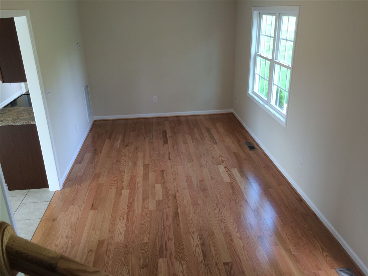 978 Buttermilk Spring Road Staunton, VA 24401 - Photo 4 of 11 an empty room with wooden floor and windows