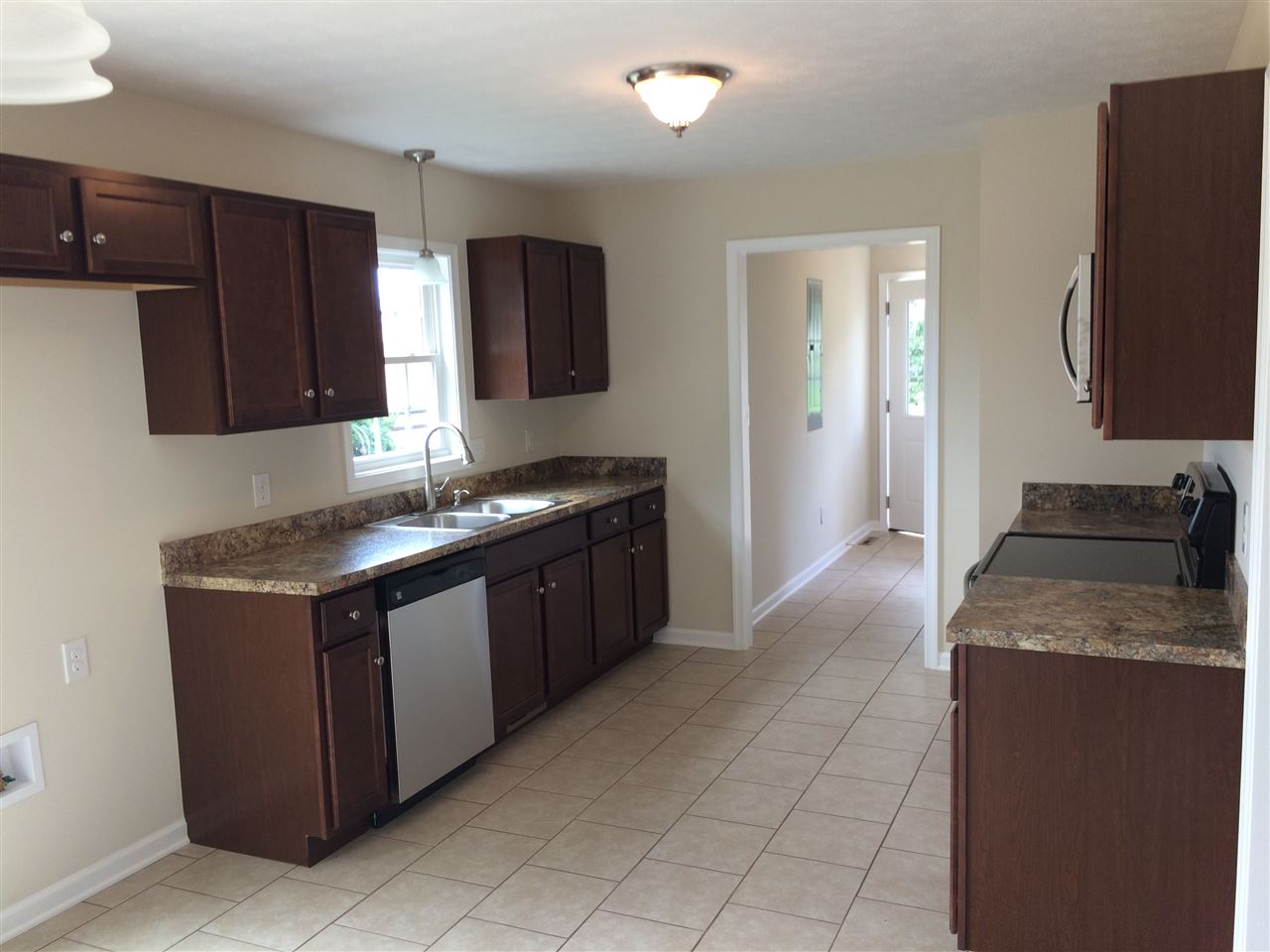 978 Buttermilk Spring Road Staunton, VA 24401 - Photo 7 of 11 a kitchen with granite countertop a sink and a stove top oven