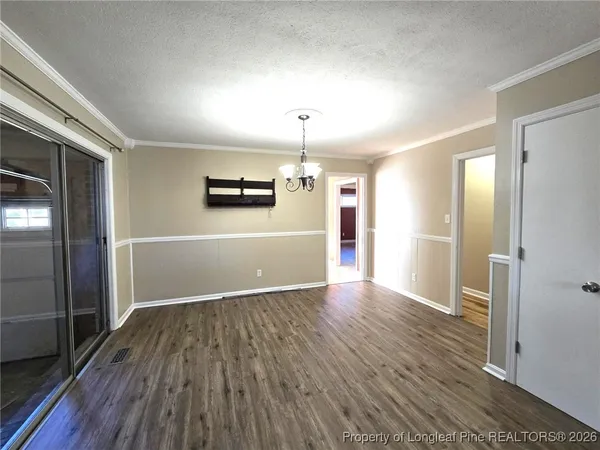 a view of a livingroom with wooden floor