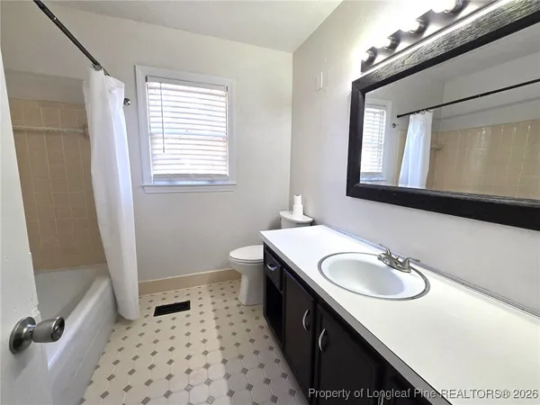 a bathroom with a sink a vanity and a mirror