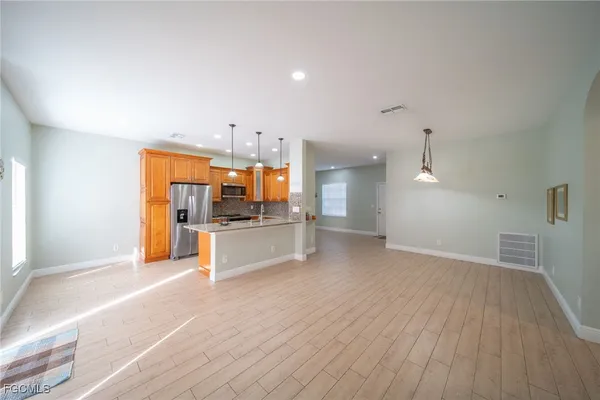 a view of kitchen and wooden floor