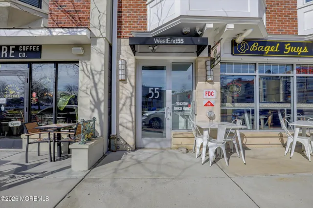 a building with table and chairs in front of building