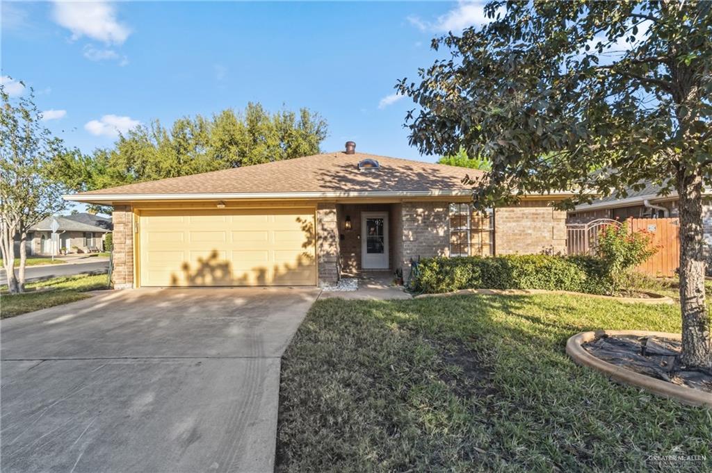 2312 Yarrow Street Mission, TX 78574 - Photo 1 of 20 a front view of a house with a yard