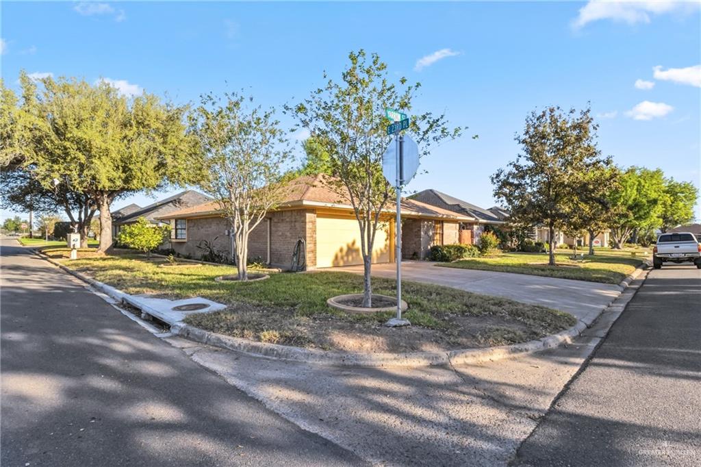 2312 Yarrow Street Mission, TX 78574 - Photo 2 of 20 a front view of a house with a yard and garage