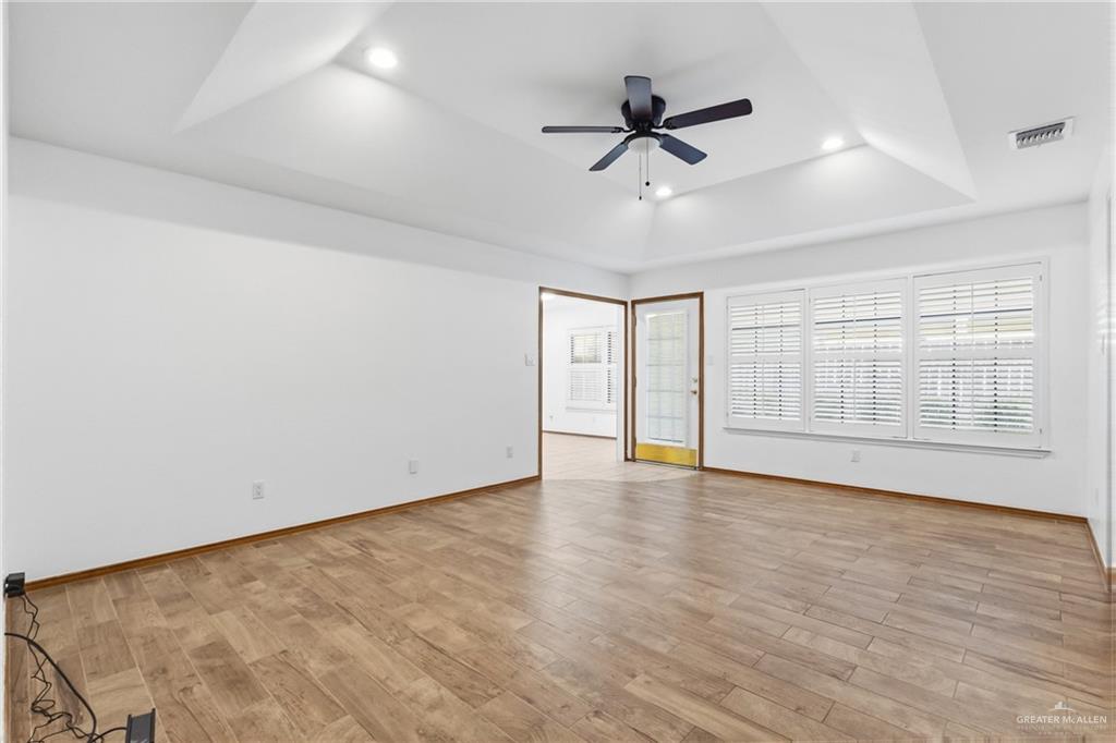 2312 Yarrow Street Mission, TX 78574 - Photo 6 of 20 wooden floor in an empty room with a window