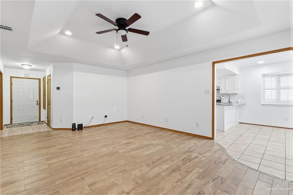 2312 Yarrow Street Mission, TX 78574 - Photo 7 of 20 wooden floor in an empty room with a window