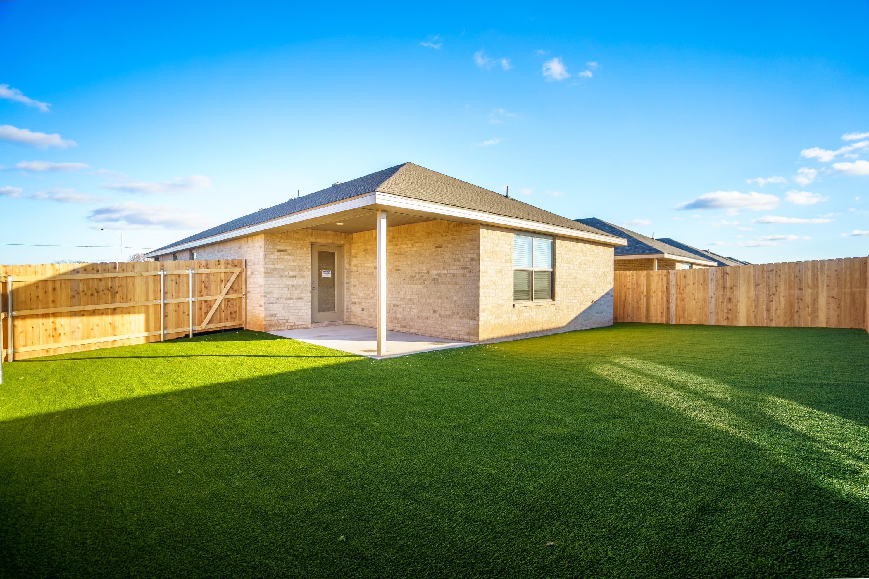 8015 Date Avenue Lubbock, TX 79404 - Photo 10 of 10 a view of a backyard with large trees
