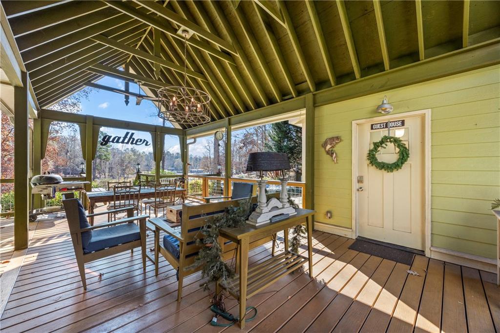 243 Bluegill Road Eatonton, GA 31024 - Photo 101 of 144 a view of a dinning tables and chairs in patio of the house